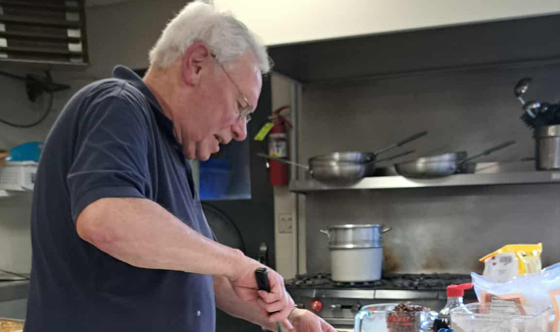 Volunteer preparing meals