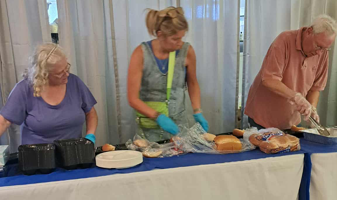 Volunteers serving food
