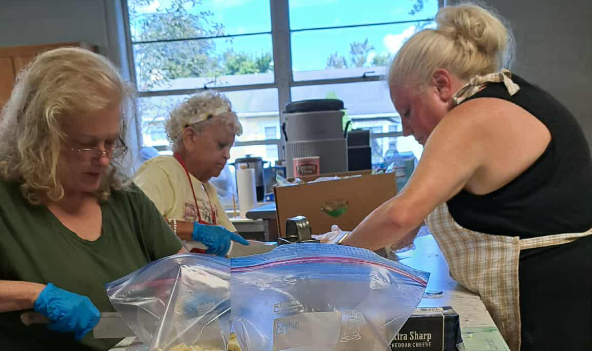 Volunteers serving community meals