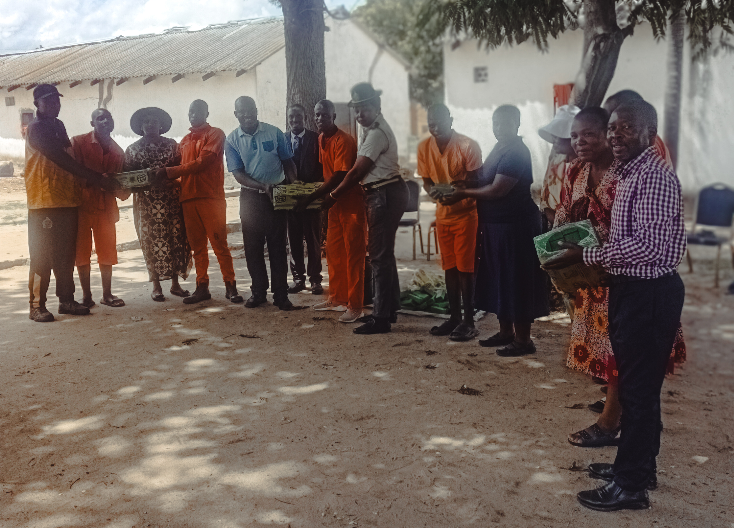 Nhamo giving soap to the prison chaplain.