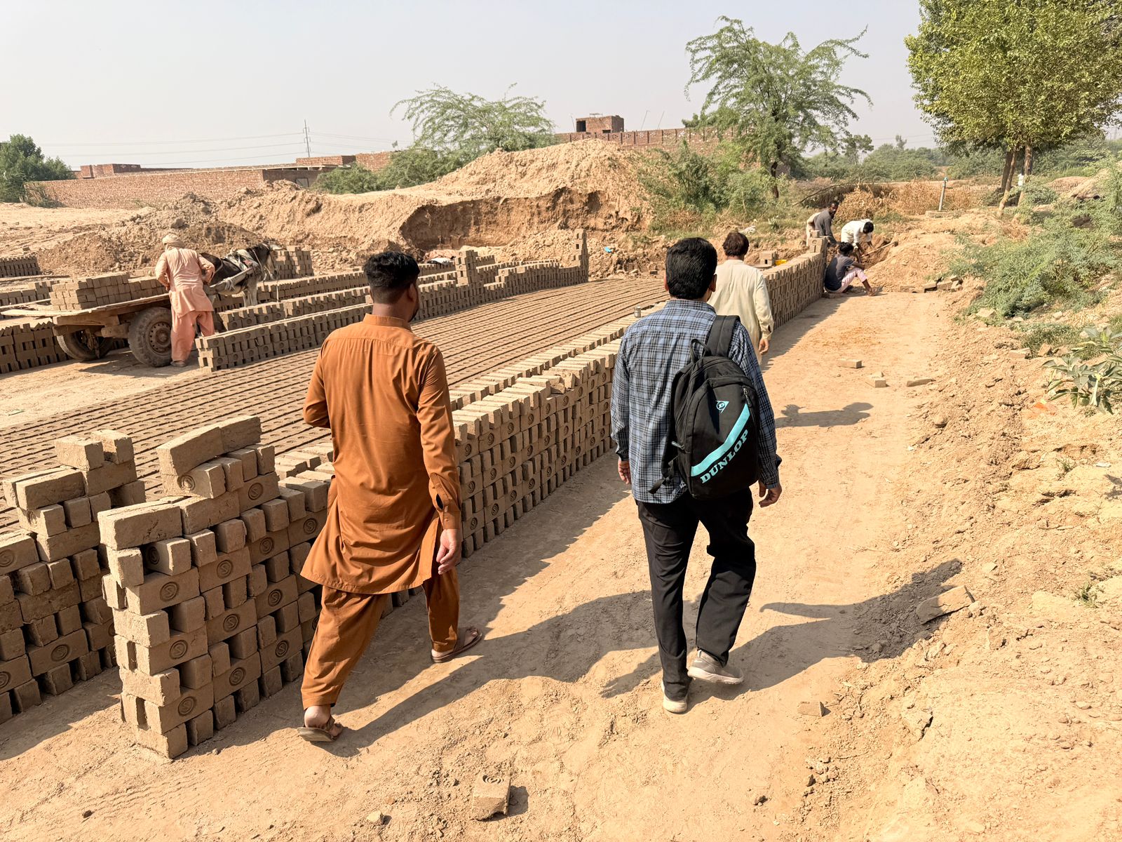 Our pastoral team walks into the brick kiln yards