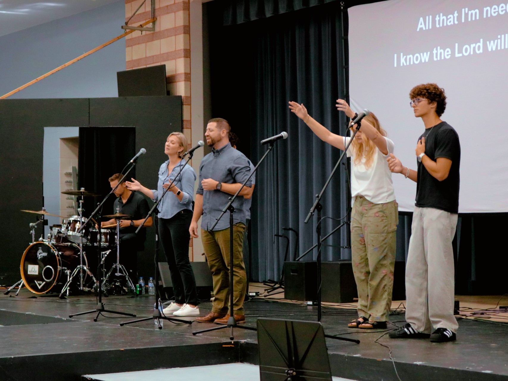 The congregation singing together during worship