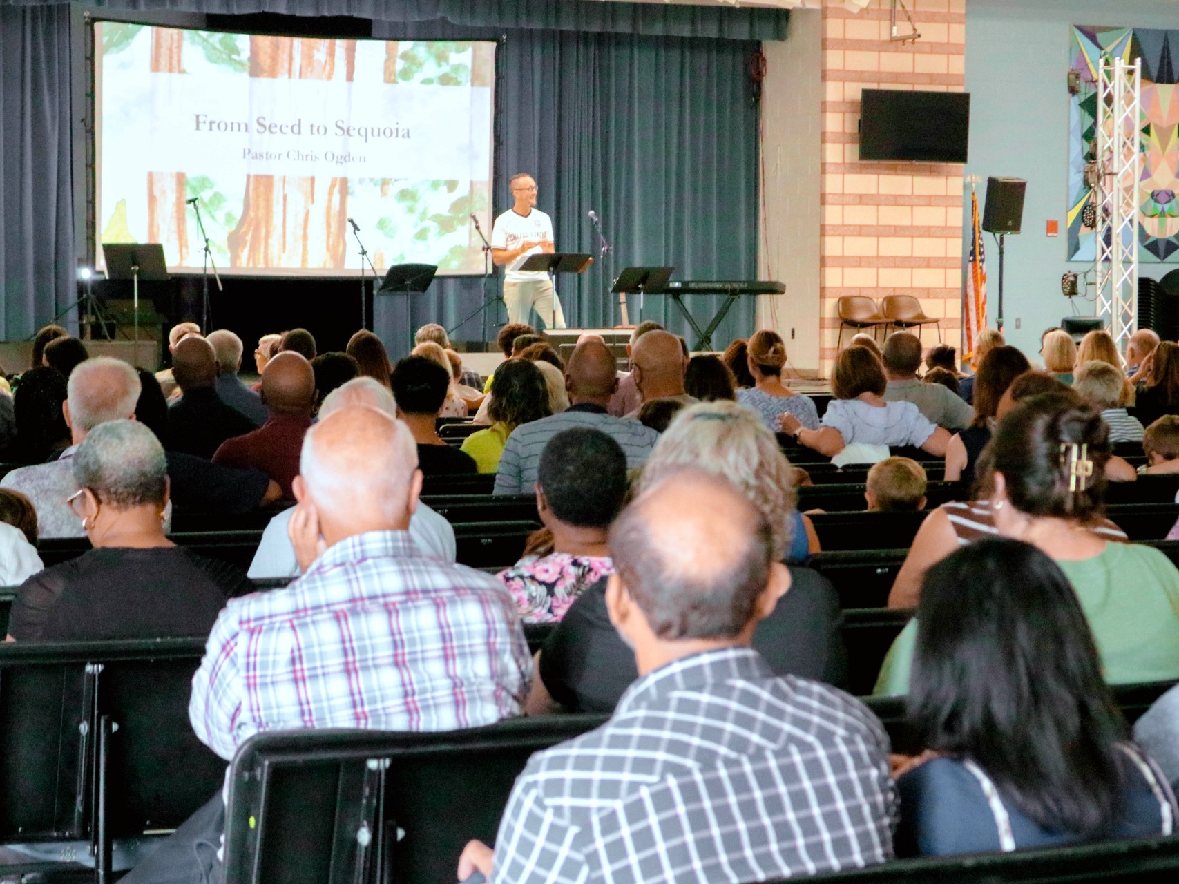 Pastor teaching from an open Bible
