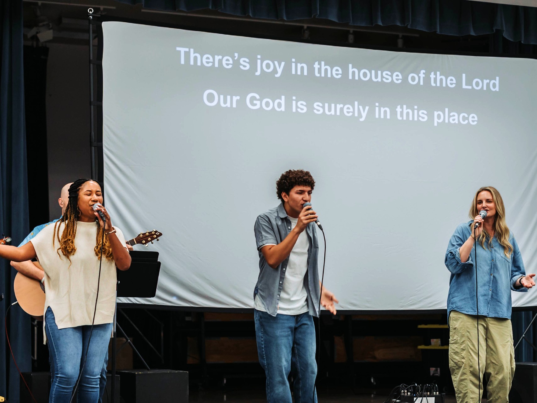 The congregation singing together during worship