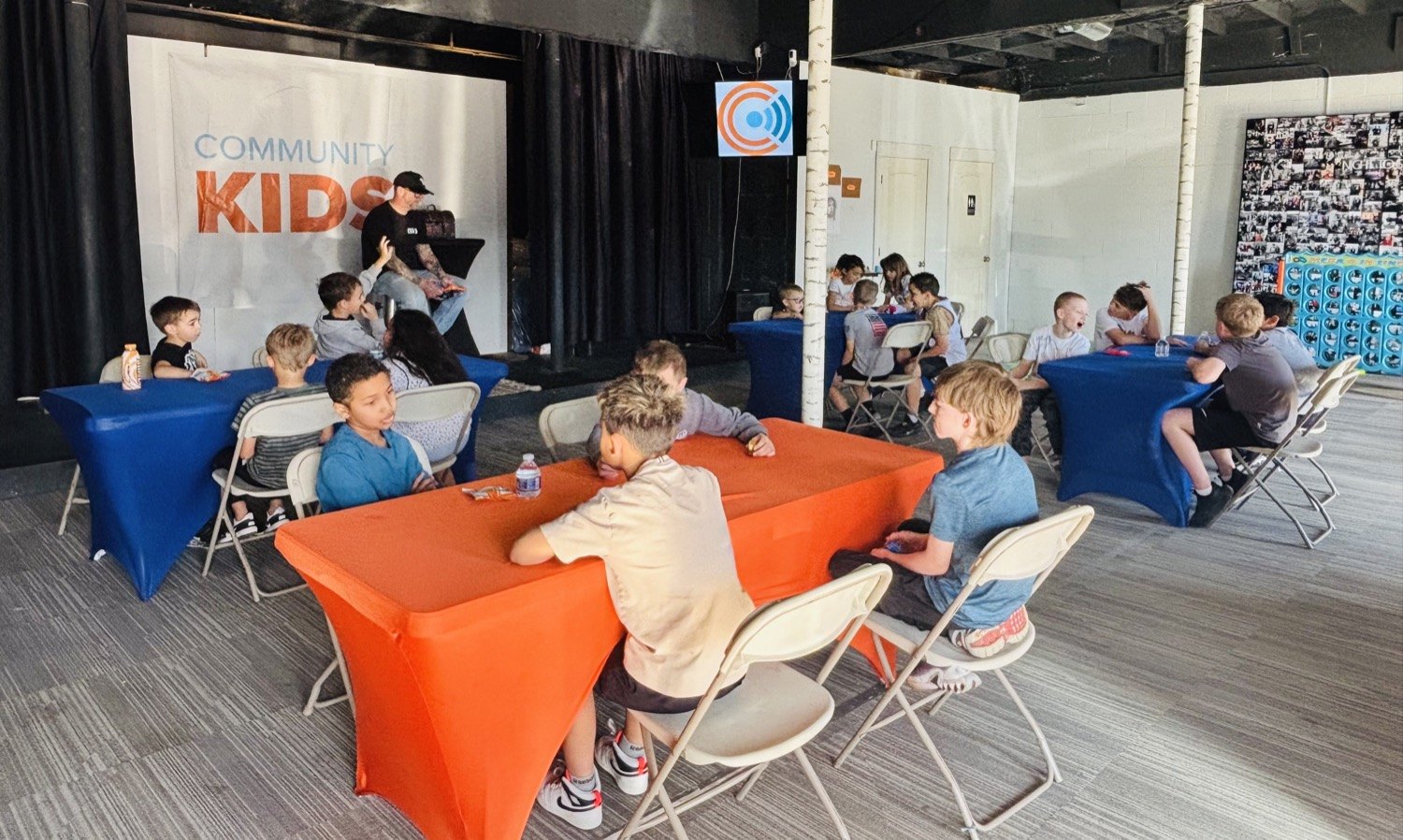 Kids at tables in the Community Kids room