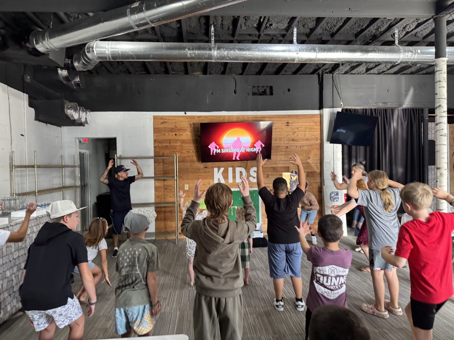 Kids worshiping in the Community Kids room