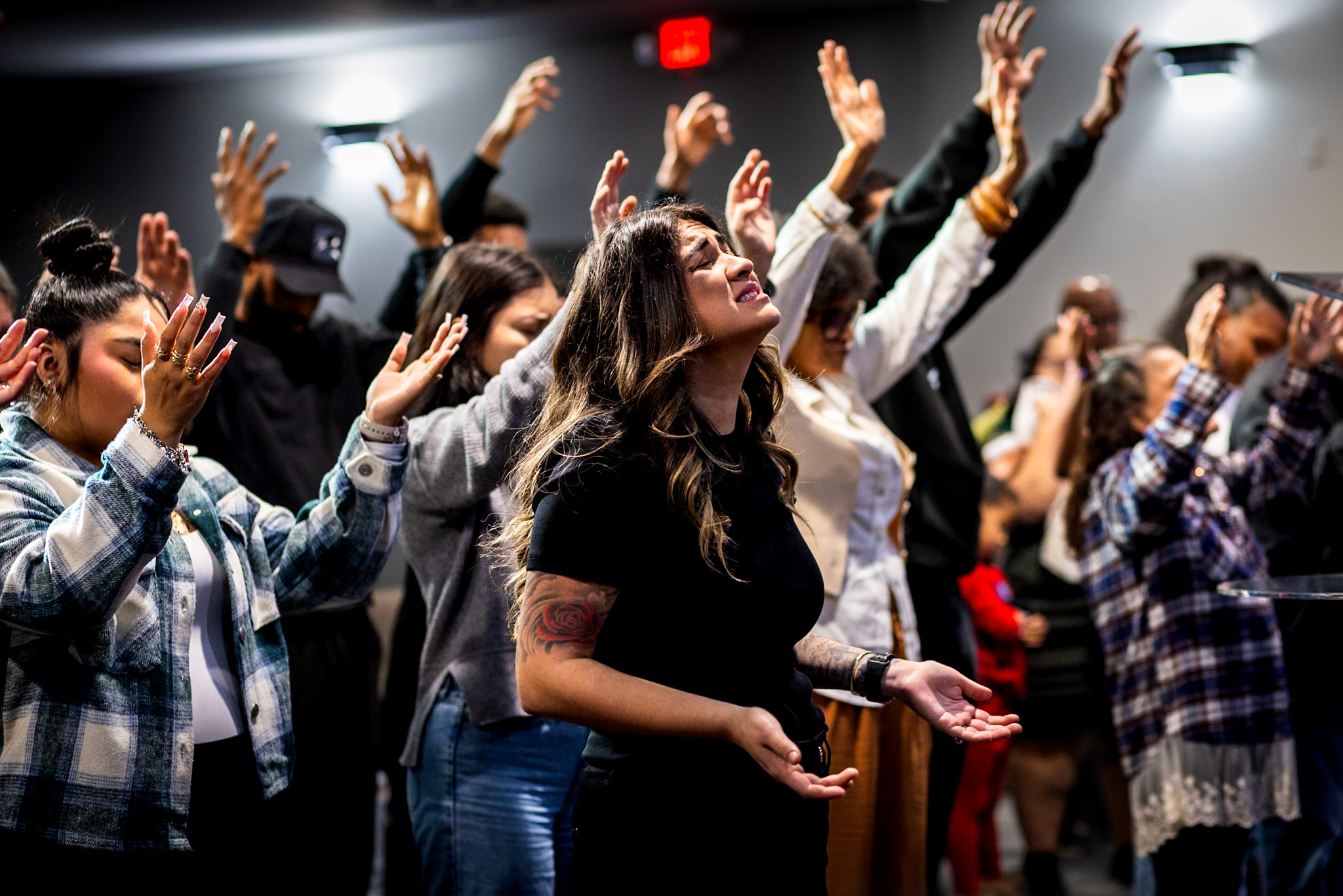 People worshipping together at Word of Life Church