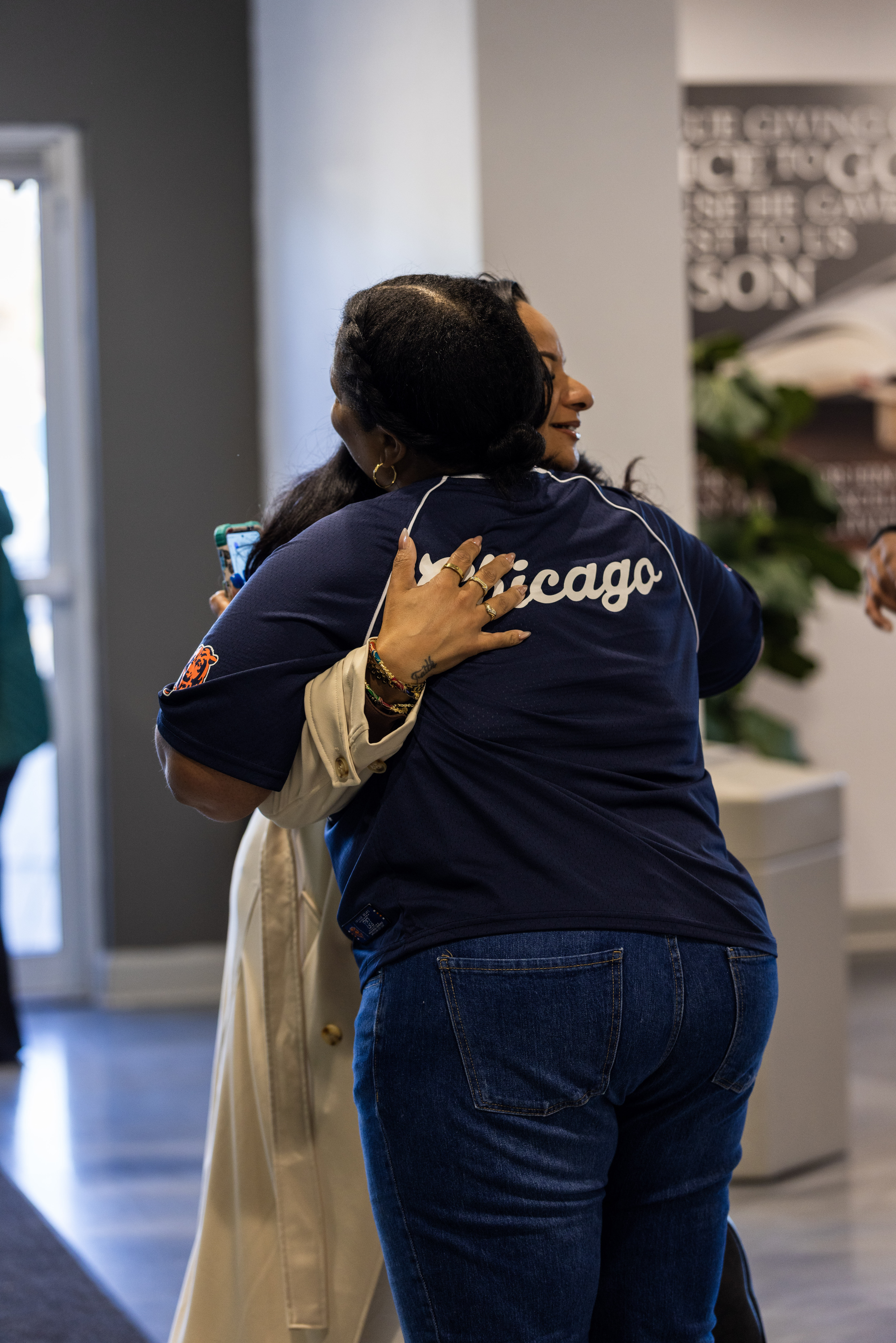 Two women sharing a hug inside Word of Life Church