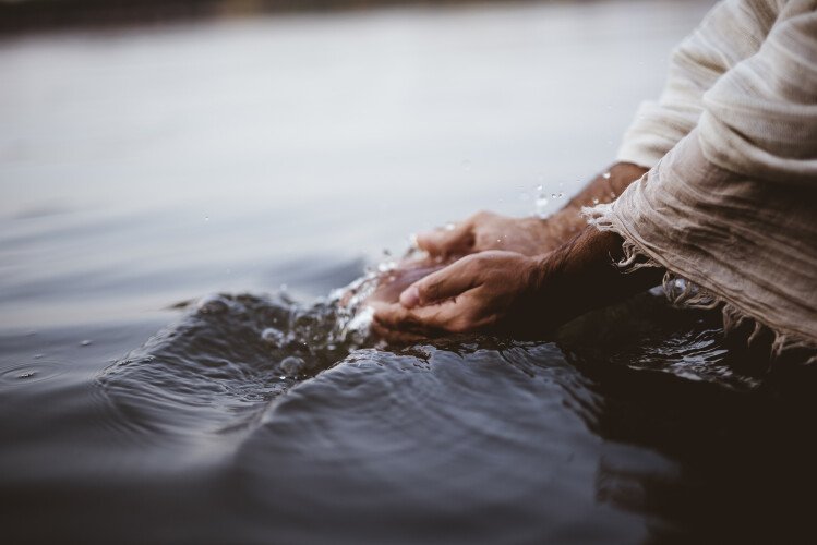 jesus hand in water picture