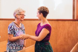 Two women shaking hands